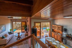 a living room with a couch and a table at Village das Estações in Marau