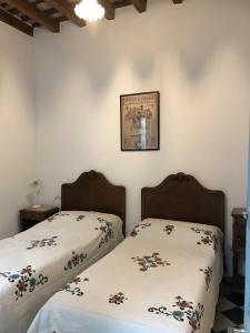 Postel nebo postele na pokoji v ubytování Casa Peral Jerez de la Frontera