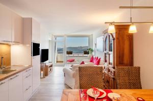 a kitchen and a living room with a couch at Wolke8 in Hahnenklee-Bockswiese