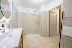 a bathroom with a white sink and a shower at Domaine De Meyrol - Gite 3 in Eyguières +29 photos