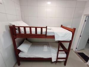 Ένα ή περισσότερα κρεβάτια σε δωμάτιο στο Essenza Suites Natal