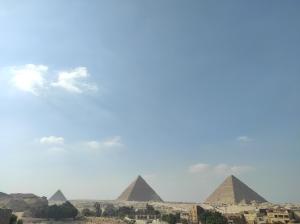 a view of the pyramids of giza from the giza desert at Egypt Pyramids Hotel in Cairo