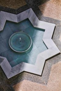 an overhead view of a fountain in a building at Hotel Bécquer in Seville
