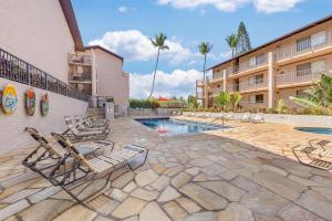 a resort with a swimming pool and lounge chairs at Kihei Alii Kai A207 · KAK A207 Renovated Kihei Condo Near Beach in Kihei
