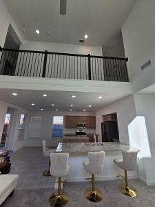 a large kitchen with a island in a living room at Talia Heaven in Mesquite