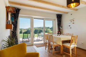 a dining room with a table and chairs at Gallushof in Lauterbach