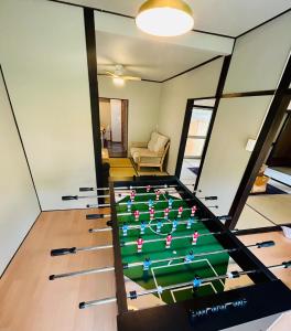 a room with a pool table in the middle at Takemi no Yado - Vacation STAY 97130v in Yufuin