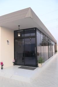 a building with a large glass door on it at B&B Villa in Ras al Khaimah