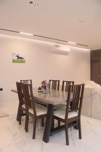 a dining room with a table and chairs at B&B Villa in Ras al Khaimah +11 photos
