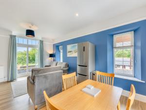 a kitchen and living room with a table and a refrigerator at Kent View Apartment in Lindale