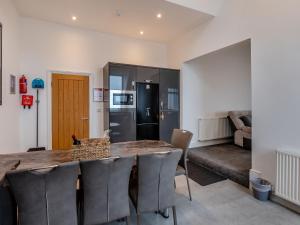 a kitchen and dining room with a table and chairs at Sea View Penthouse - Regency Mansion in Redcar