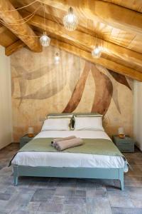 Ένα ή περισσότερα κρεβάτια σε δωμάτιο στο Bed and Breakfast Cascina Morelli 1862