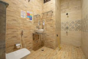 a bathroom with a sink and a toilet at goSTOPS Amritsar, Golden Temple in Amritsar +49 photos