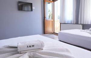 Postel nebo postele na pokoji v ubytování Gold Boutique Apart & Hotel