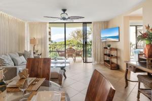 a living room with a couch and a table at Valley Isle 401 · VI 401 Remodeled OceanFront Condo w Ocean View in Kahana