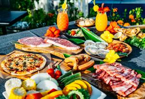 a table topped with lots of different types of food at Seaside Village 13(シーサイドヴィレッジ・サーティーン) in Ishigaki Island +100 photos