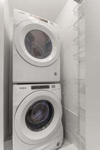 a washer and dryer with a washing machine in a bathroom at Ocean Front Escape - 1106 Beachview Dr in Demere Park