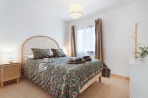 Postel nebo postele na pokoji v ubytování Oasis Duna surfhouse Corralejo pool + 21 fotografií