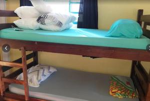Giường trong phòng chung tại Pousada da Neia
