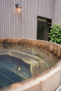 a swimming pool with a bench in front of a building at Night experience in Pessac
