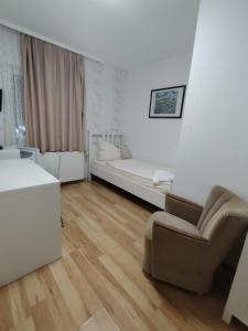 a living room with a couch and a bed at The Crestline in Hannover