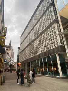 a group of people standing outside of a building at The Crestline in Hannover