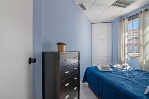 Postel nebo postele na pokoji v ubytování Faro Downtown Suites - Vila Adentro