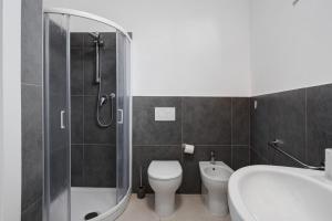 a bathroom with a toilet and a shower and a sink at Montemare in Ameglia +20 photos