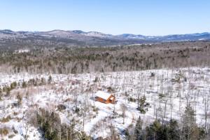 an aerial view of a cabin in a snow covered field at Brightwind Lodge in Newry