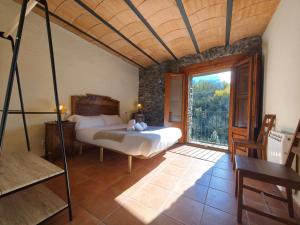 Postel nebo postele na pokoji v ubytování Allotjaments Cal Llarg