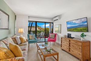 a living room with a couch and a table at Kihei Akahi C302 · AKH C302 Spacious 2BD Condo w Ocean Breeze AC in Wailea