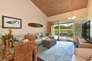 a living room with a couch and a table at Napili Shores F246 · NS F246 Spacious Condo w Pools AC Near Napi in Kahana