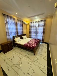 a bedroom with a bed in a room at Shuja Ranches in Kilifi