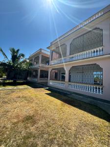 a large building with the sun in the sky at Shuja Ranches in Kilifi