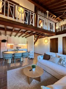 a living room with a couch and a table at Villa Dorotea - Casa Rural Vallines in Vallines