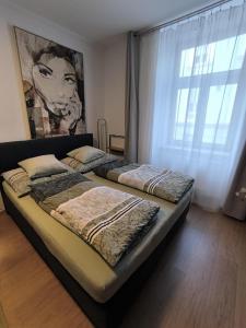 Postel nebo postele na pokoji v ubytování Wohnung in Leoben Zentrum Zwischen Hauptplatz und Stadtpark