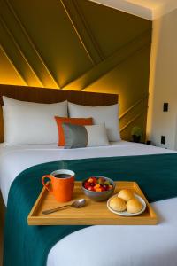 Ένα ή περισσότερα κρεβάτια σε δωμάτιο στο Flat Praia Comfort Camburi