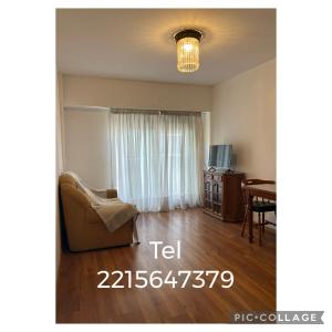 a living room with a couch and a dining room table at Depto 51 in La Plata +2 photos