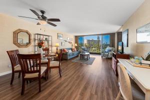 a living room with a ceiling fan and a dining room at Maui Kaanapali Villas 415 · MKV 415 Updated Condo w Ocean View a in Kahana
