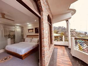 A balcony or terrace at Quiet Edge Resort A Luxury Room With Balcony By Anvi Retreat