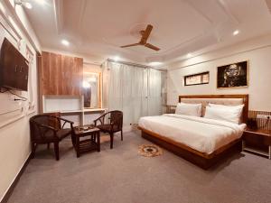 A bed or beds in a room at Quiet Edge Resort A Luxury Room With Balcony By Anvi Retreat