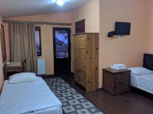 Postel nebo postele na pokoji v ubytování Hotel Wintera Gudauri + 10 fotografií