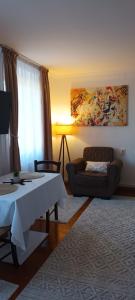 a living room with a table and a couch at Studio O&A in Cristian