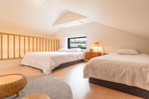 Ένα ή περισσότερα κρεβάτια σε δωμάτιο στο In Aewol Forest 101