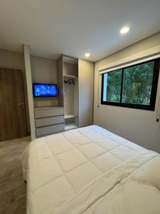 Giường trong phòng chung tại Harmony - 2 ambientes a 150m del mar - valeria del mar