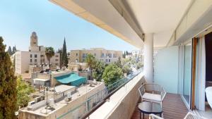 a balcony with a view of a city at KING DAVID RESIDENCES - Pool & Gym in Jerusalem