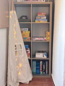 a book shelf with a tent in front of it at Hostalet d'Horta in Santa María de Horta