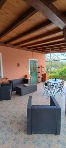 a living room with couches and a table in a room at Il Vigneto "Cottage" in Gaggi +37 photos