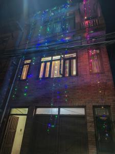 a building with christmas lights on the side of it at 'Timeless Bhaktapur Home' in Bhaktapur