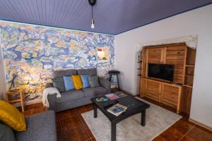 TV a/nebo společenská místnost v ubytování Casa Sol Nascente